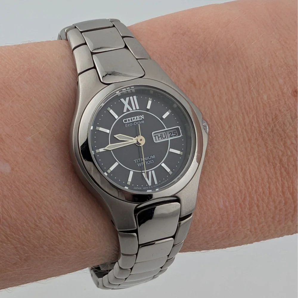 Citizen Eco-Drive Titanium E001-K18451 Women's WR100 Day Date Black Dial Watch